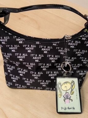Black Shoulder Bag with 'It's All About Me' Print and Character Charm
